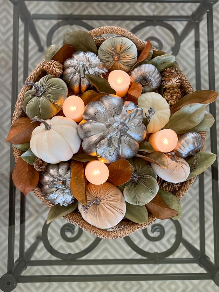 Flameless candles in a fall coffee table arrangement