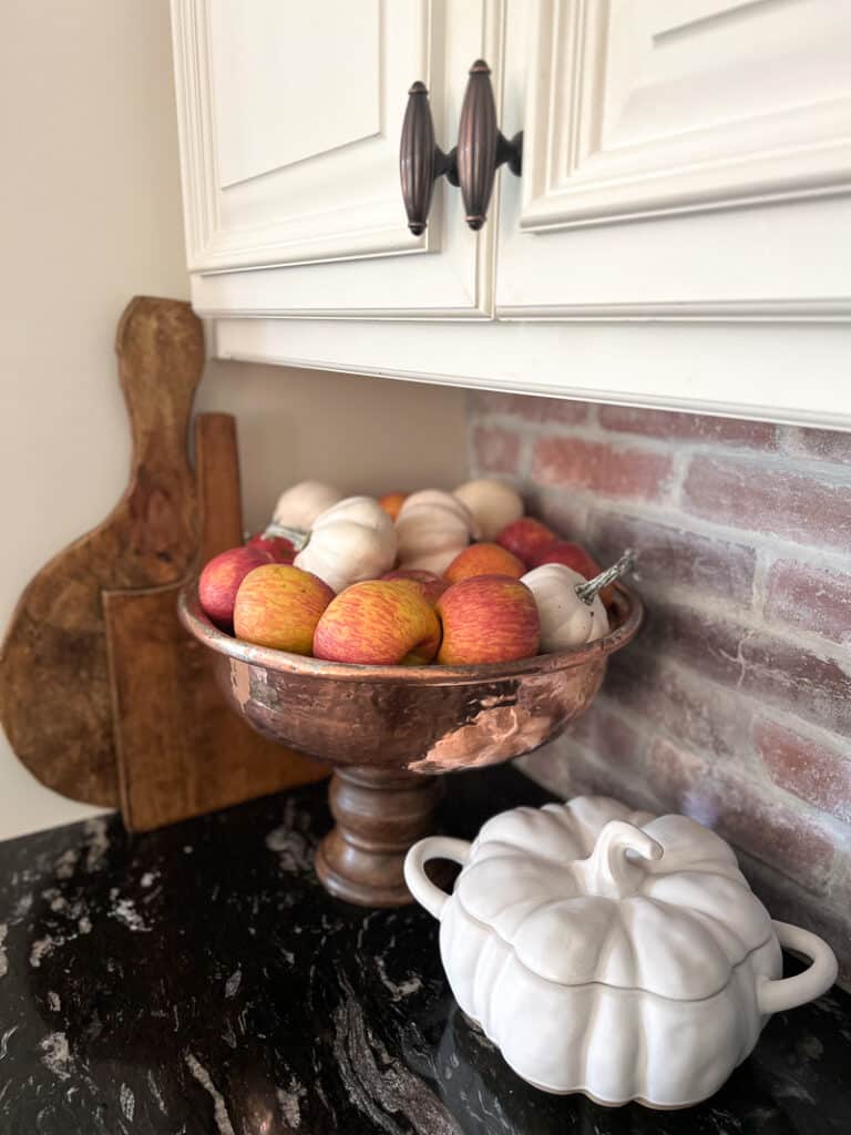 Copper bowl with pumpkins and apples for fall