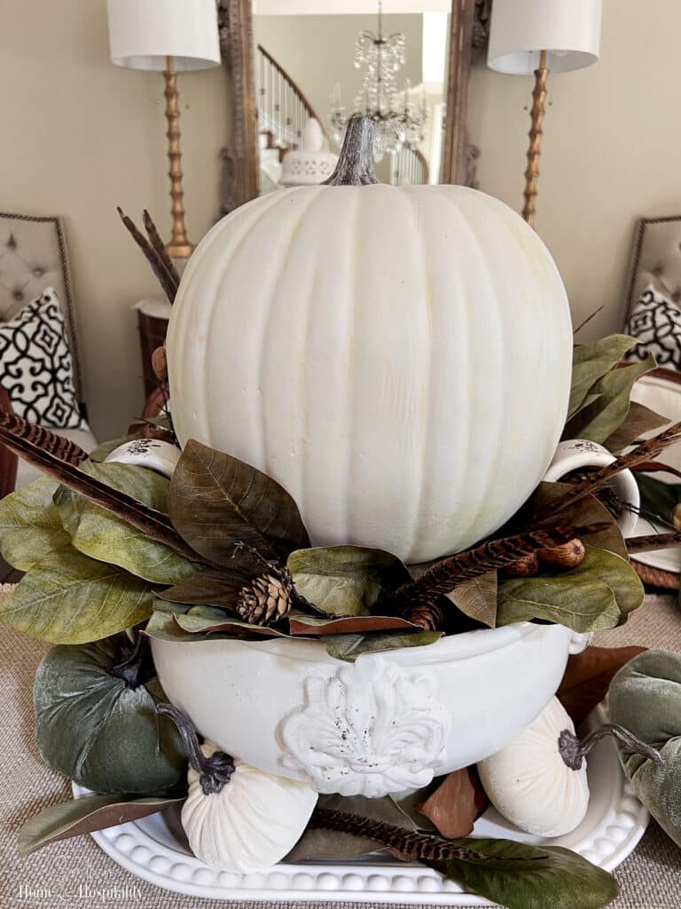 Pedestal bowl with pumpkin and magnolia leaves