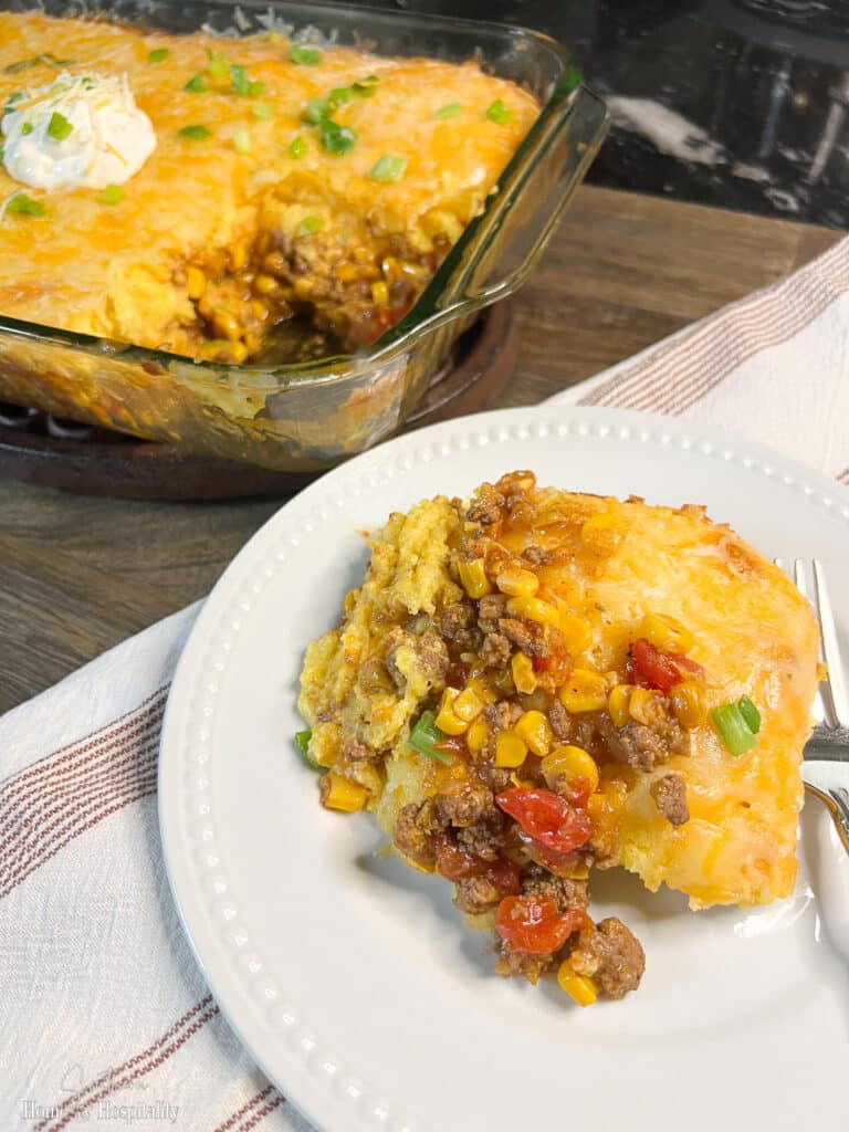Mexican cornbread casserole with ground beef, cheese, corn, Rotel tomatoes