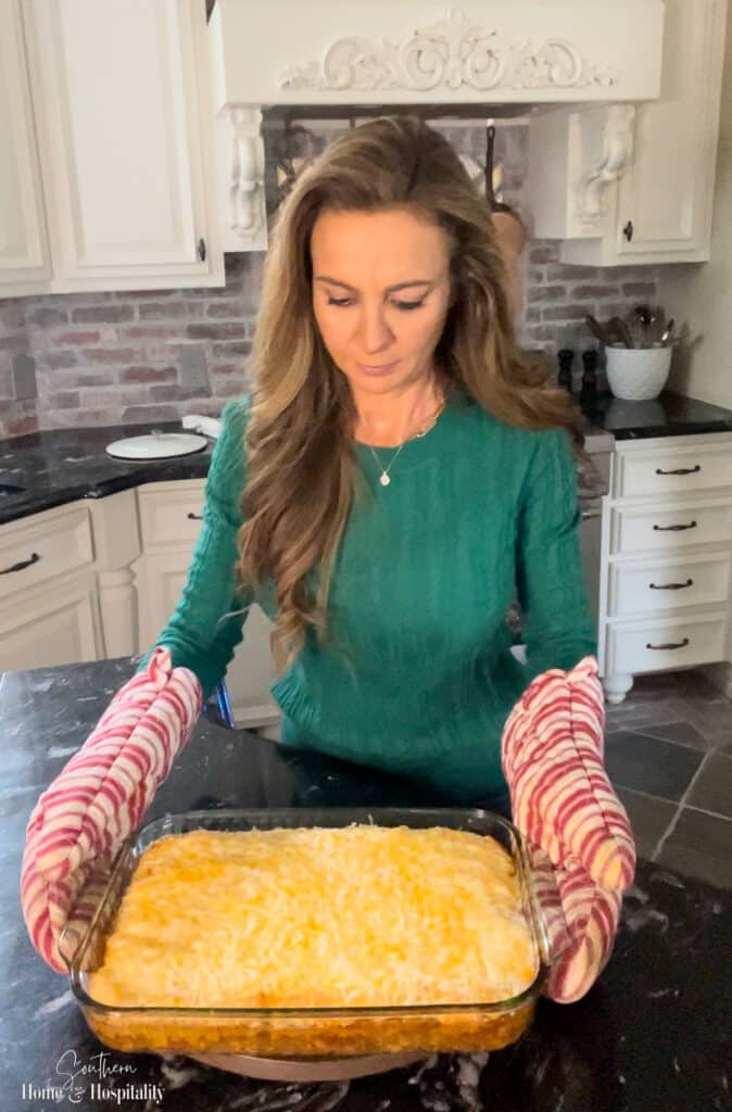Taking baked mexican cornbread casserole out of the oven