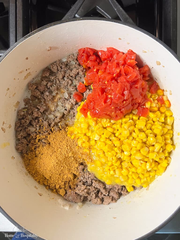 Ingredients for Mexican cornbread casserole meat filling in pot