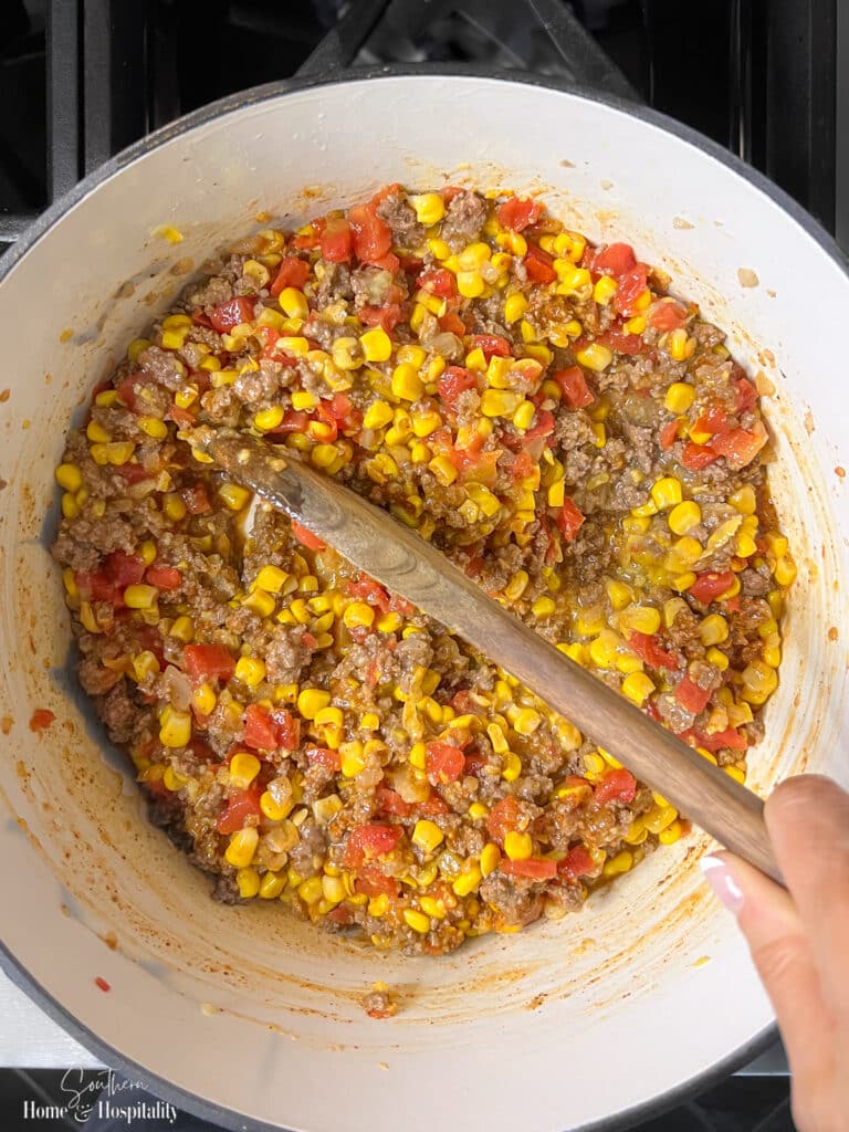 Cooking meat mixture for Mexican cornbread casserole on stovetop