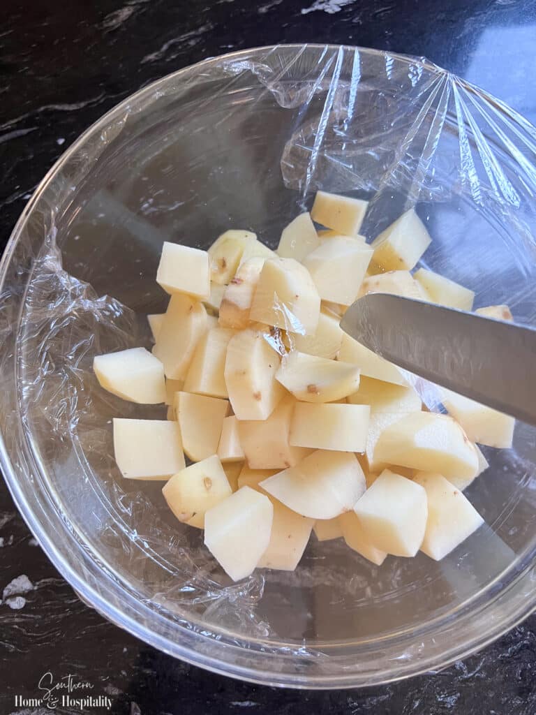 piercing plastic wrap to vent potatoes in the microwave