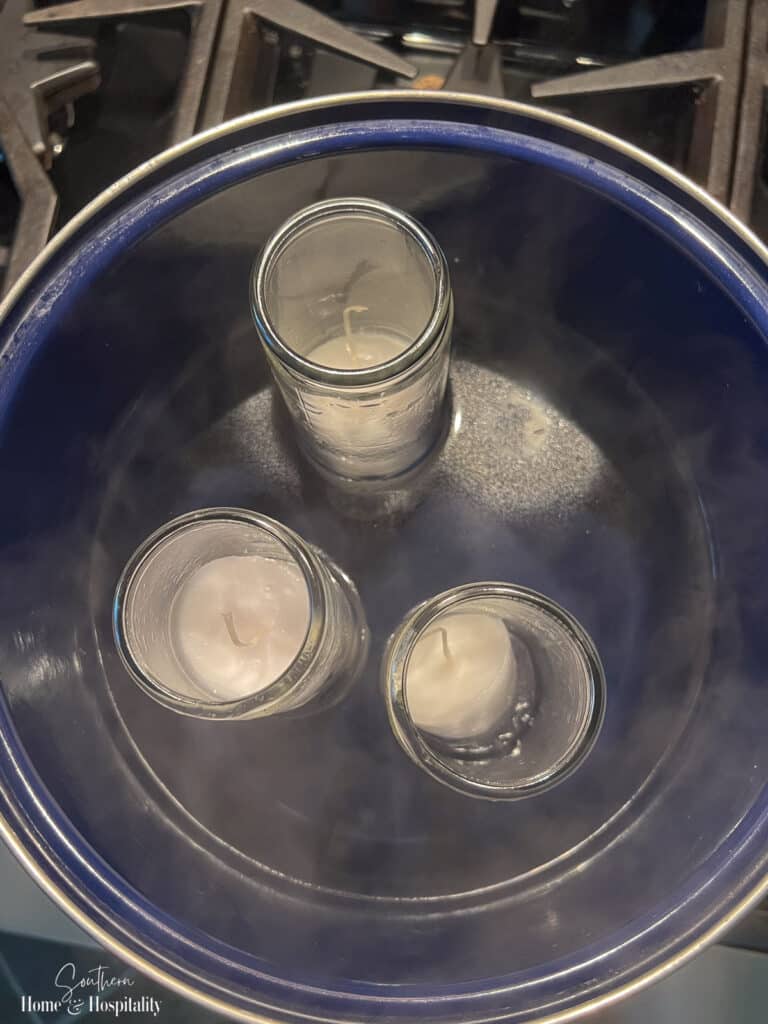 Melting candles in a pot of boiling water