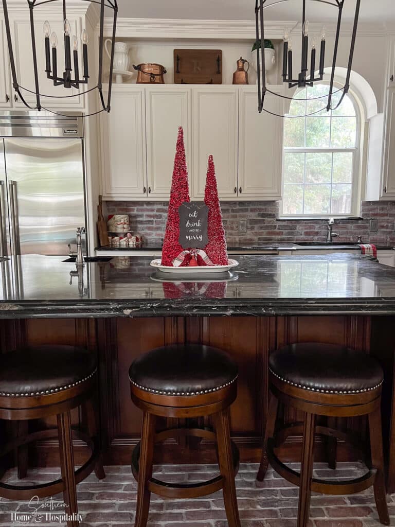 Red berry cones centerpiece on kitchen island