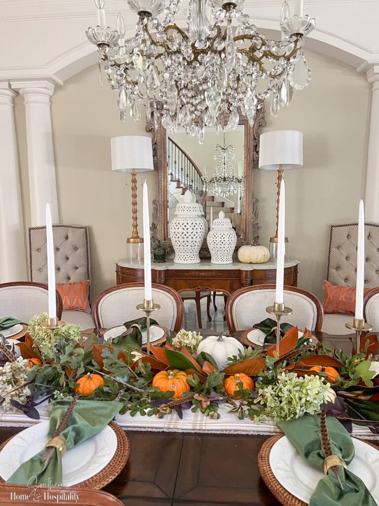 Natural thanksgiving table decor with pumpkins and yard cuttings