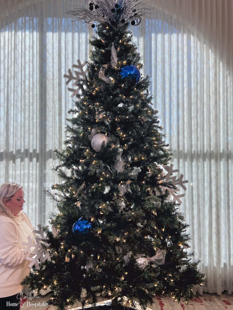 Putting large decor on Christmas tree