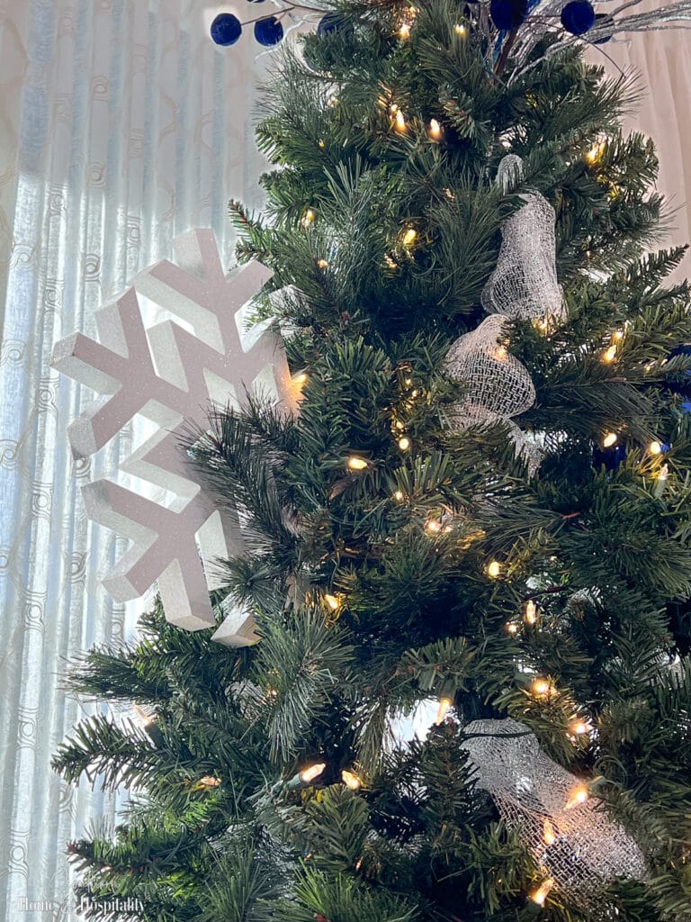 Large wooden snowflake in Christmas tree