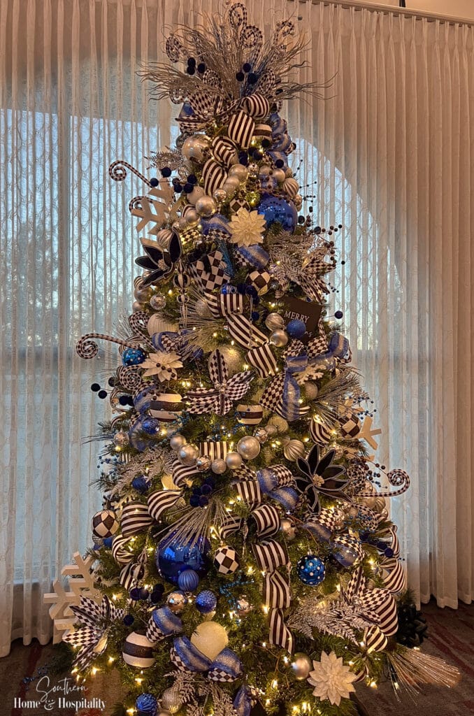 Christmas tree with diamond pattern and striped ribbon and blue decor