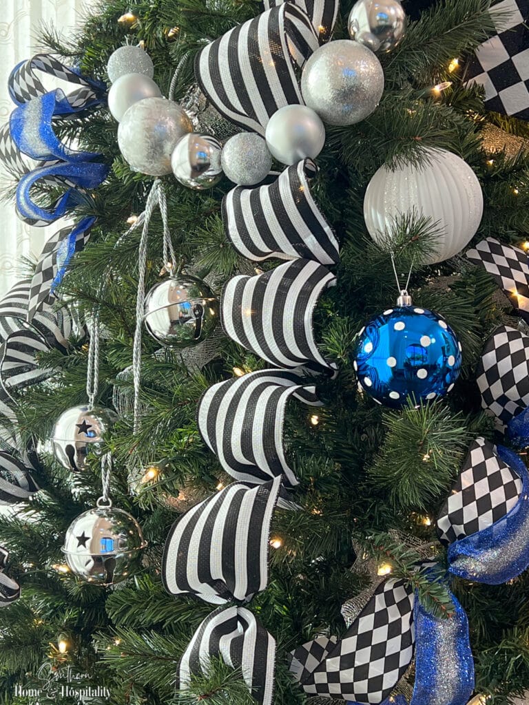 Silver jingle bells on Christmas tree