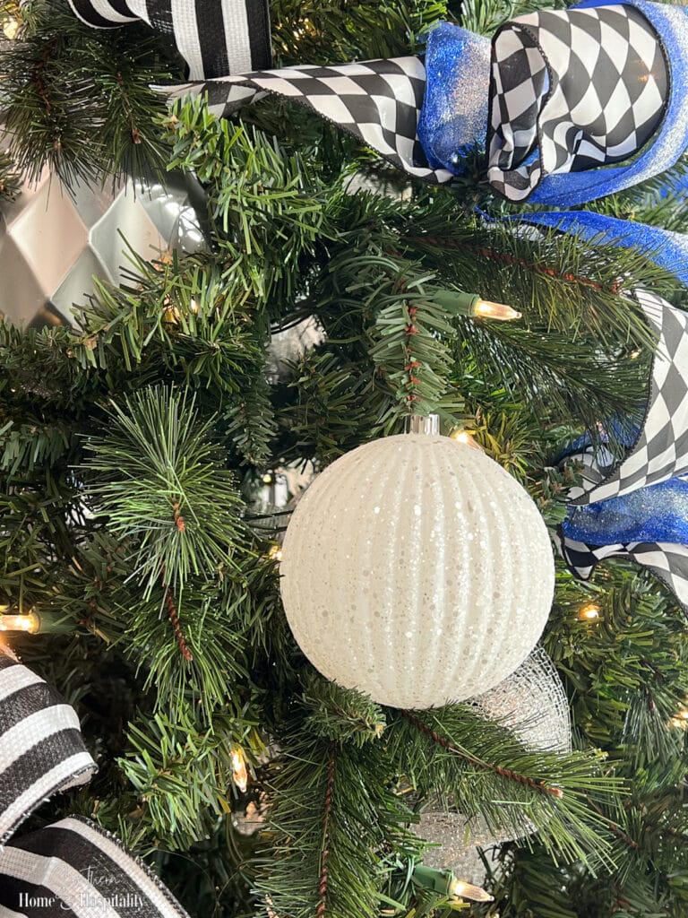 Ornament attached with artificial tree branch