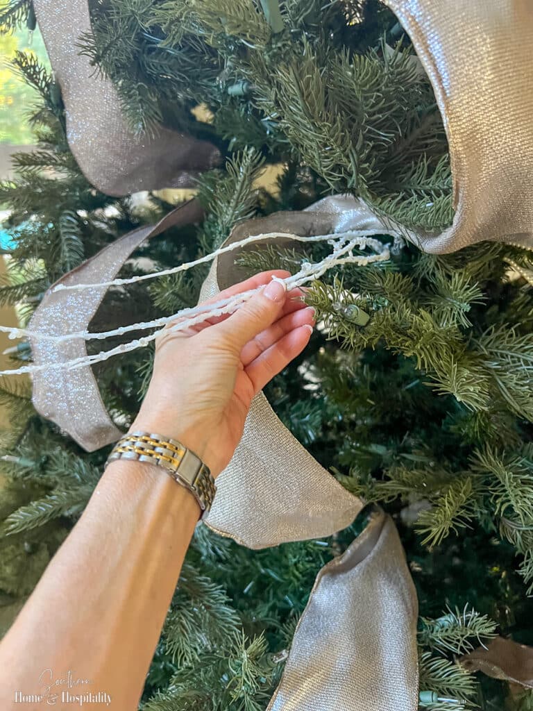 White sparkle twig picks on Christmas tree