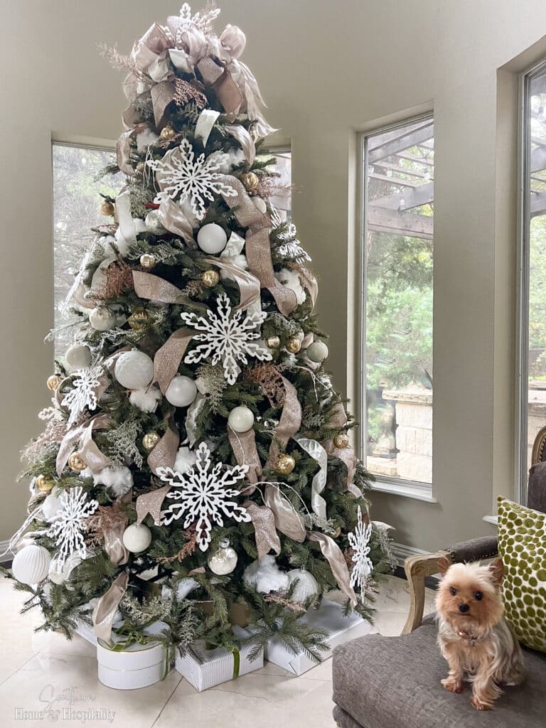Gold and white Christmas tree with dusters as fake snow