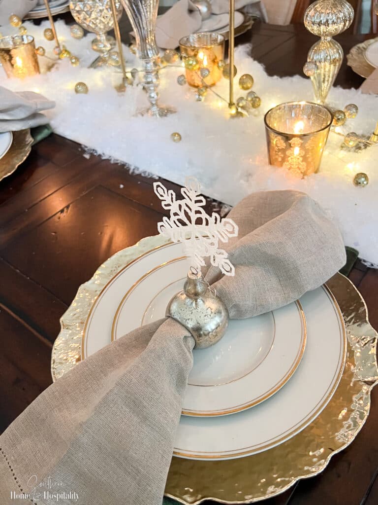 Gold and white snowflake table setting