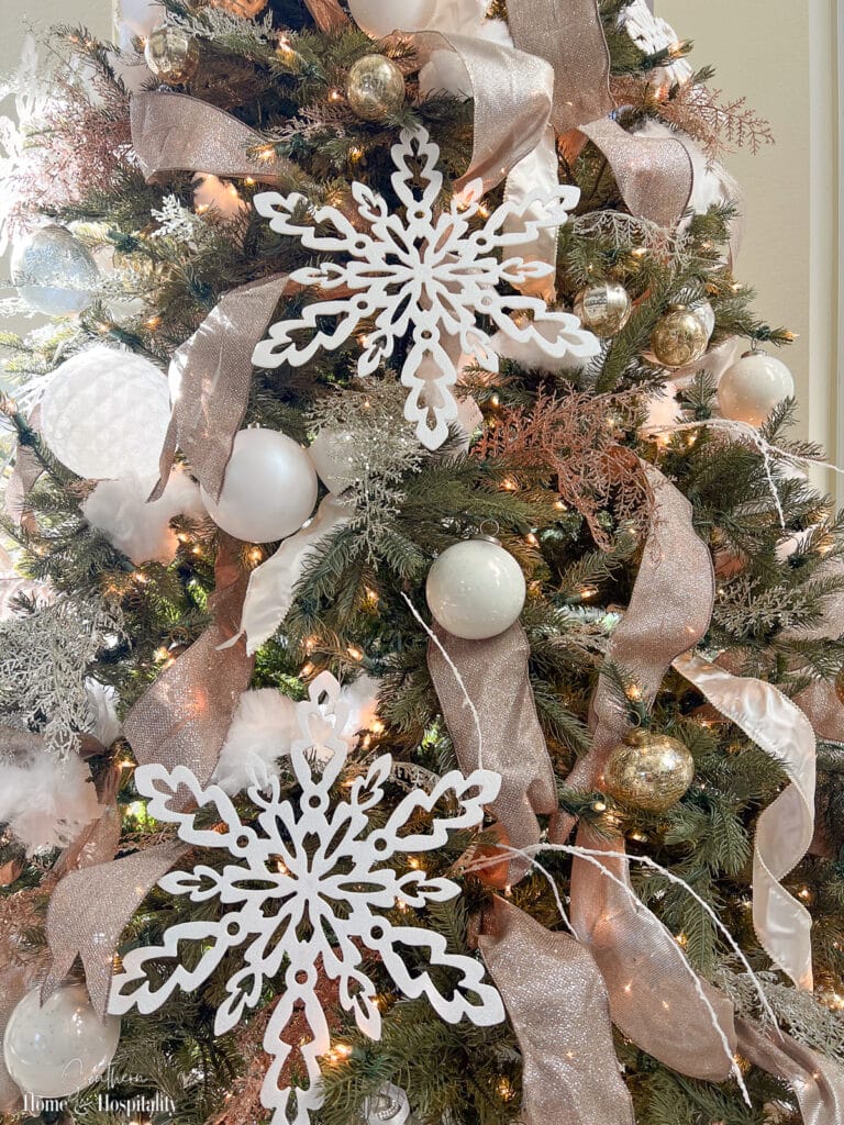 White and gold ornaments and decor on Christmas tree