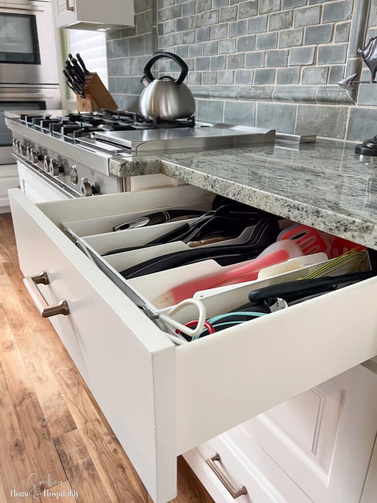 Extra deep utensil drawer beside stove in kitchen
