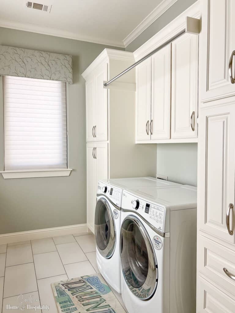 Soft blue green window valances in laundry room