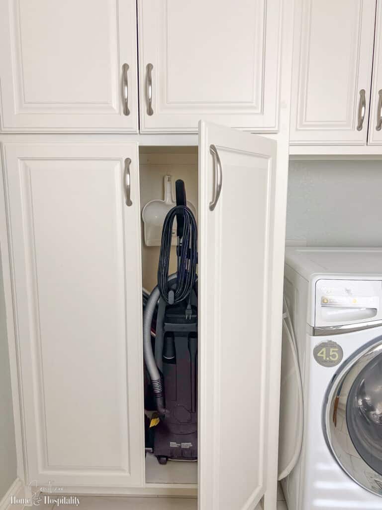 Laundry room cabinet for vacuum cleaner, mops, and brooms