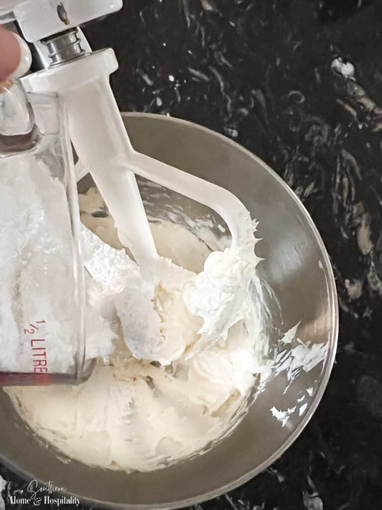 Adding powdered sugar to cream cheese frosting