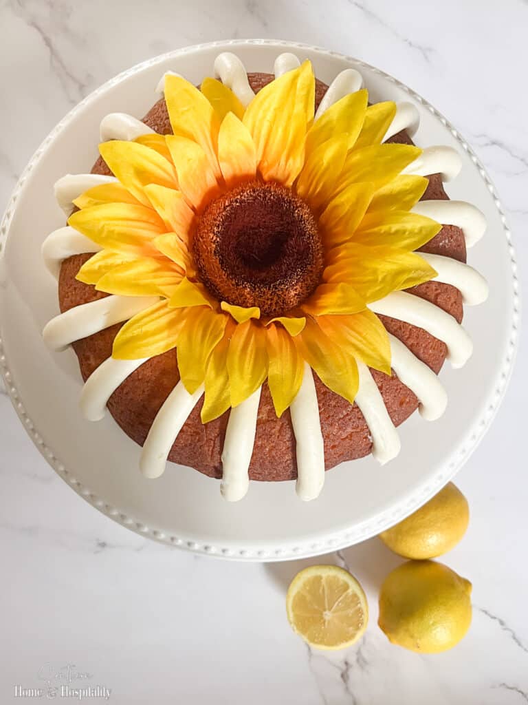 Artificial sunflower on top of homemade Nothing Bundt Cake lemon cake