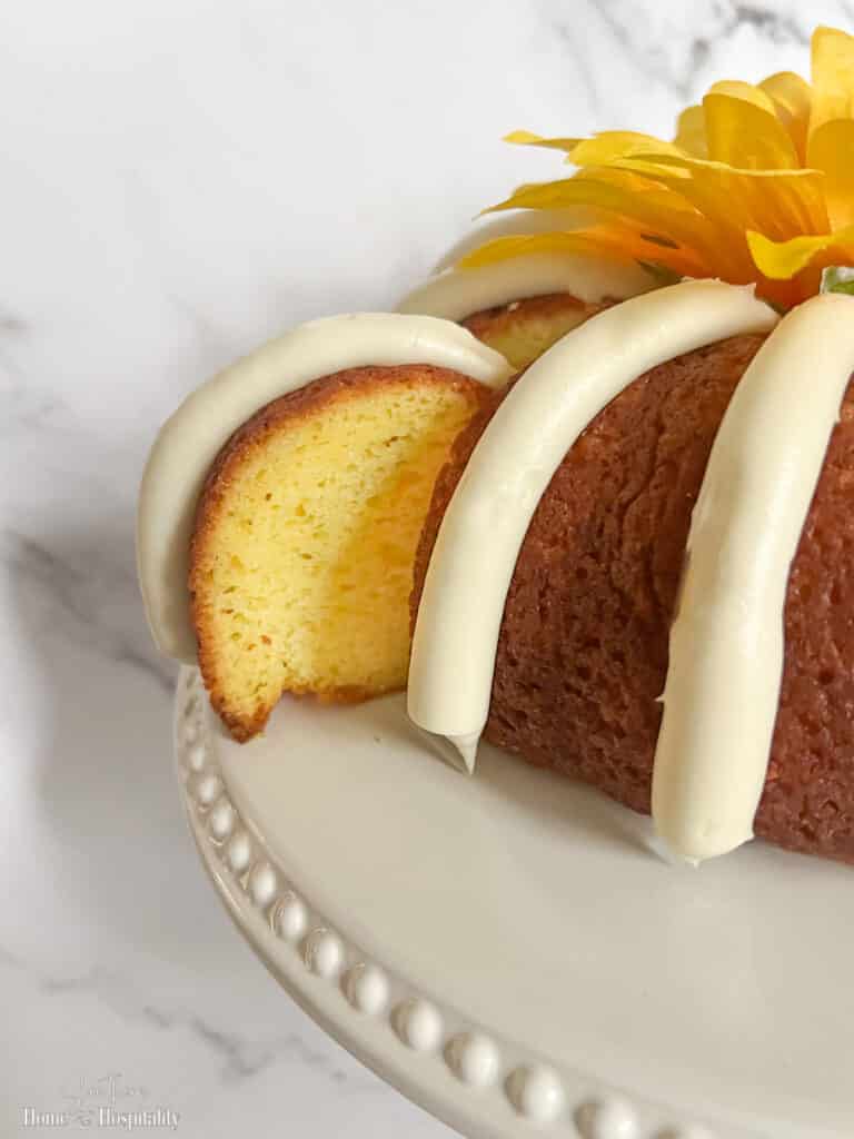 Nothing Bundt Cake copycat lemon bundt cake slice with cream cheese icing stripe