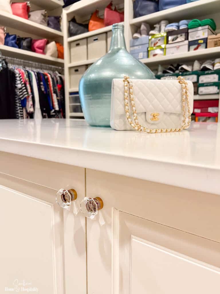 Crystal knobs with aged gold on closet island