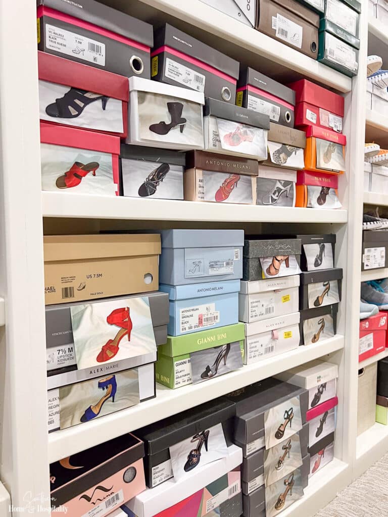 Shoe boxes with photos on closet shelves