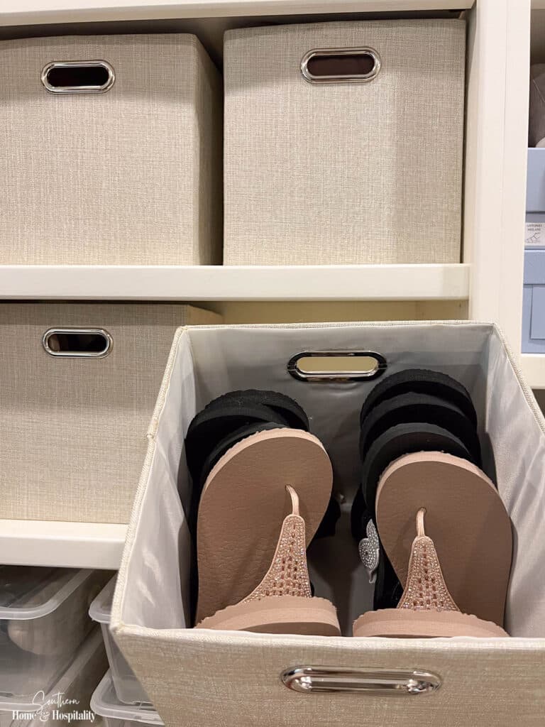 Flip flops in storage cube in closet