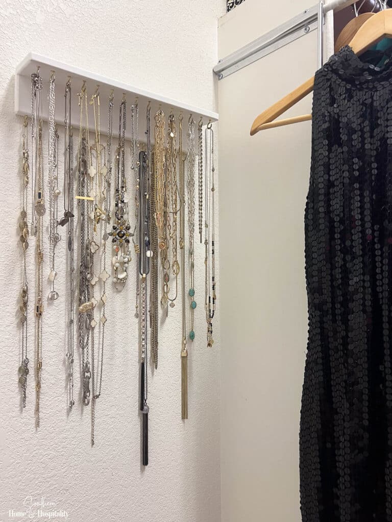 Wall rack for necklaces in closet