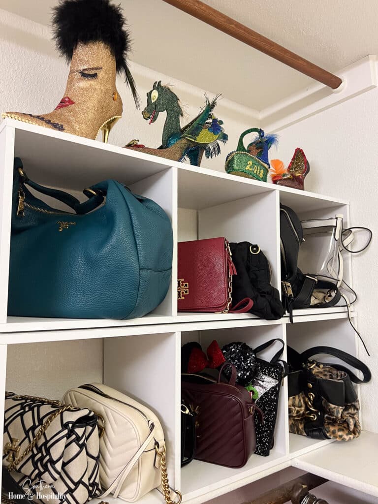 Purses stored in stackable cubes in closet