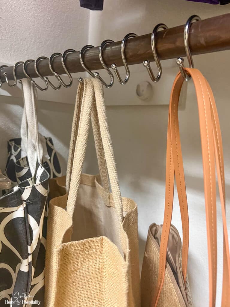 Shower hooks on closet rod for hanging accessories