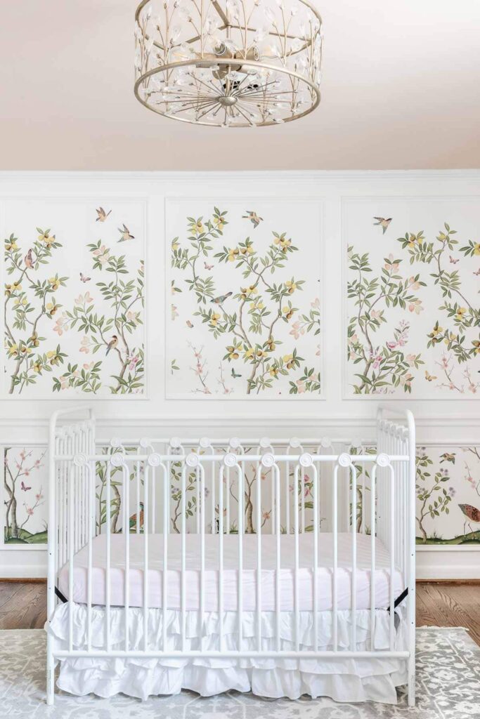 Wallpaper in picture frame molding in a nursery