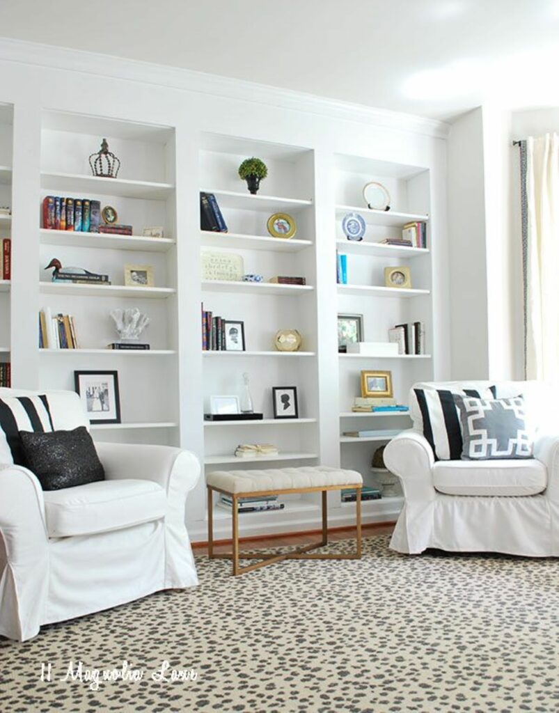 Full wall DIY bookshelves made with Ikea bookcases