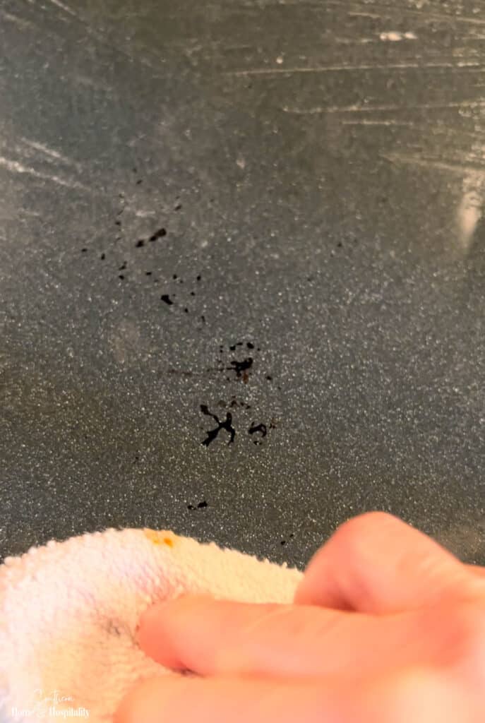 Remaining stain in oven after baking soda and vinegar cleaning