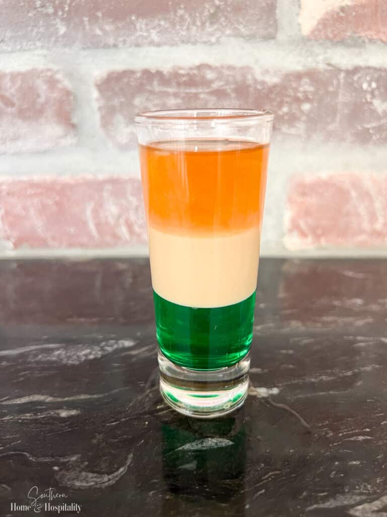 Layered shooter with green white and orange