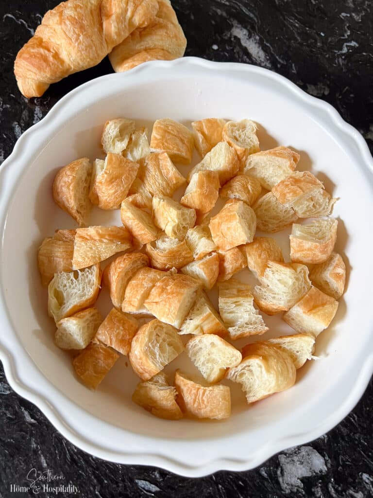 Croissant pieces in baking dish