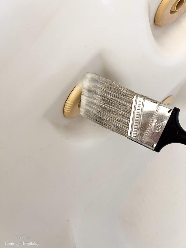 Brushing hair developer on tub jet nozzles to whiten