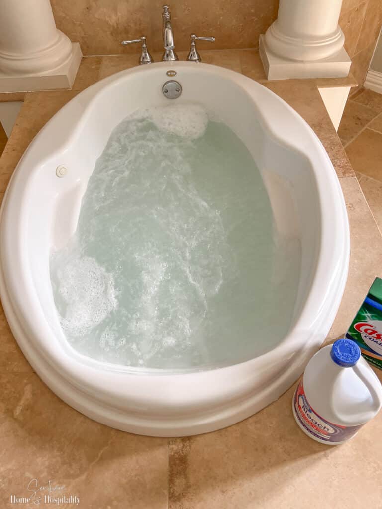 Dishwasher detergent and bleach solution running in jetted tub