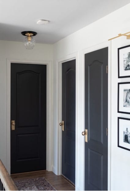 Painted black interior doors and white walls
