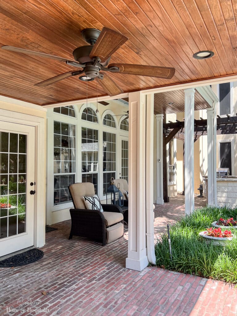 Stained wood beadboard ceiling on patio