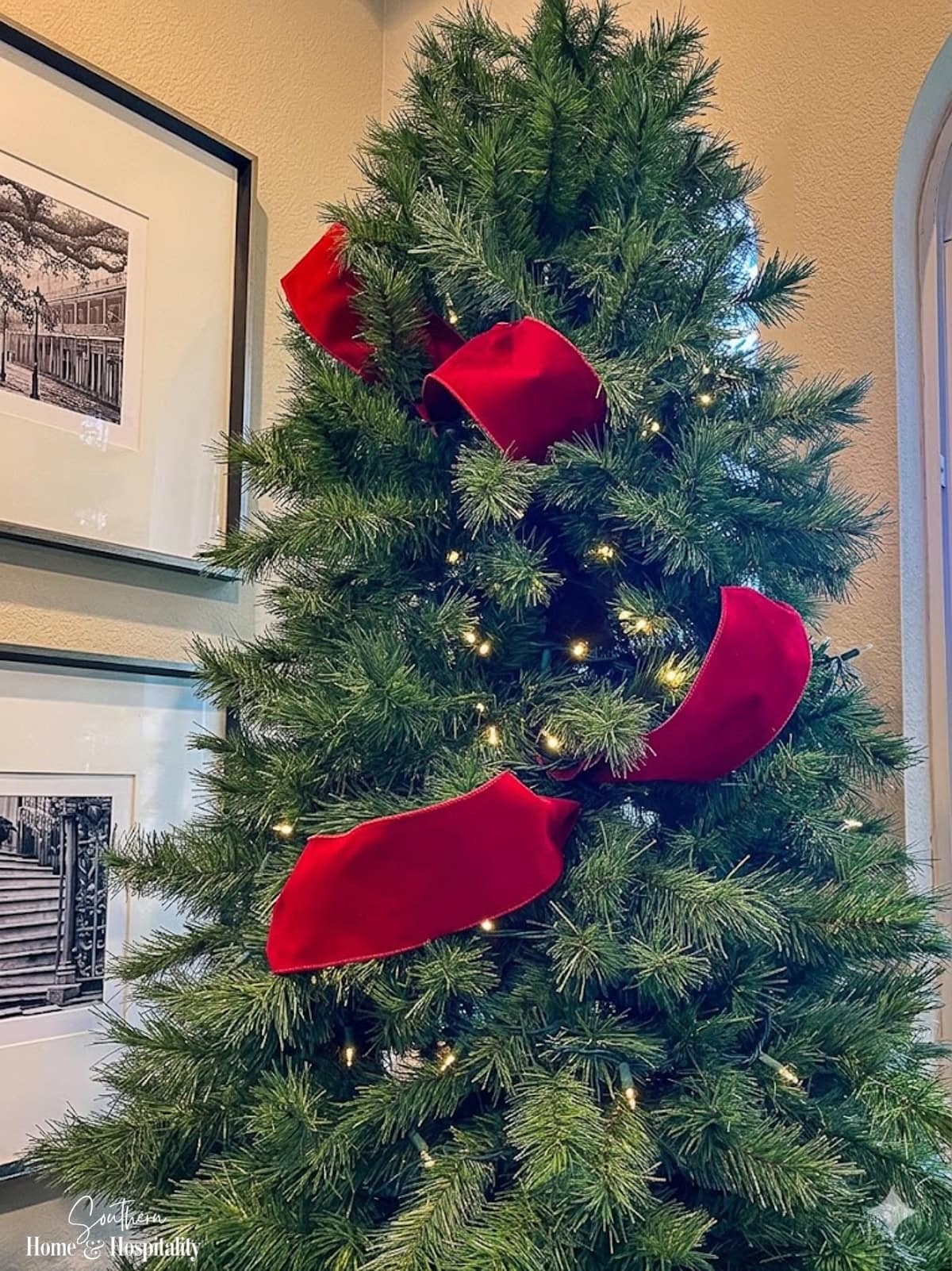 Red ribbon on Christmas tree