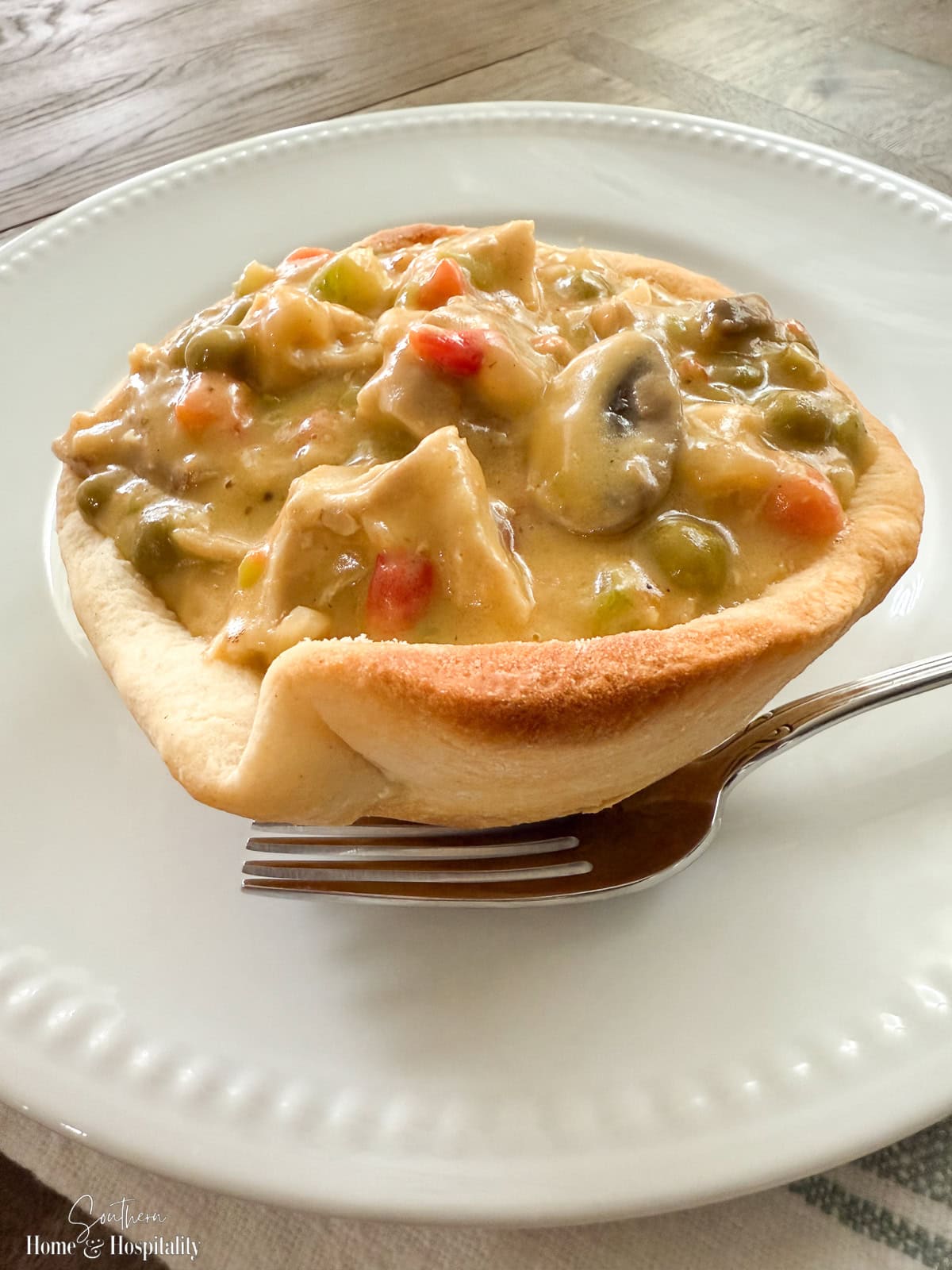 Chicken a la king in a biscuit bowl