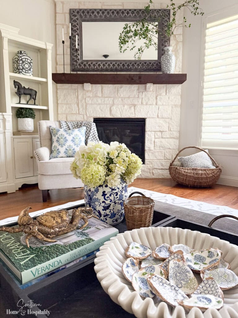 Decoupage oyster shells in bowl on coffee table
