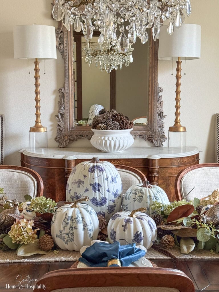 Dining sideboard styled with bowl of pinecones for fall.