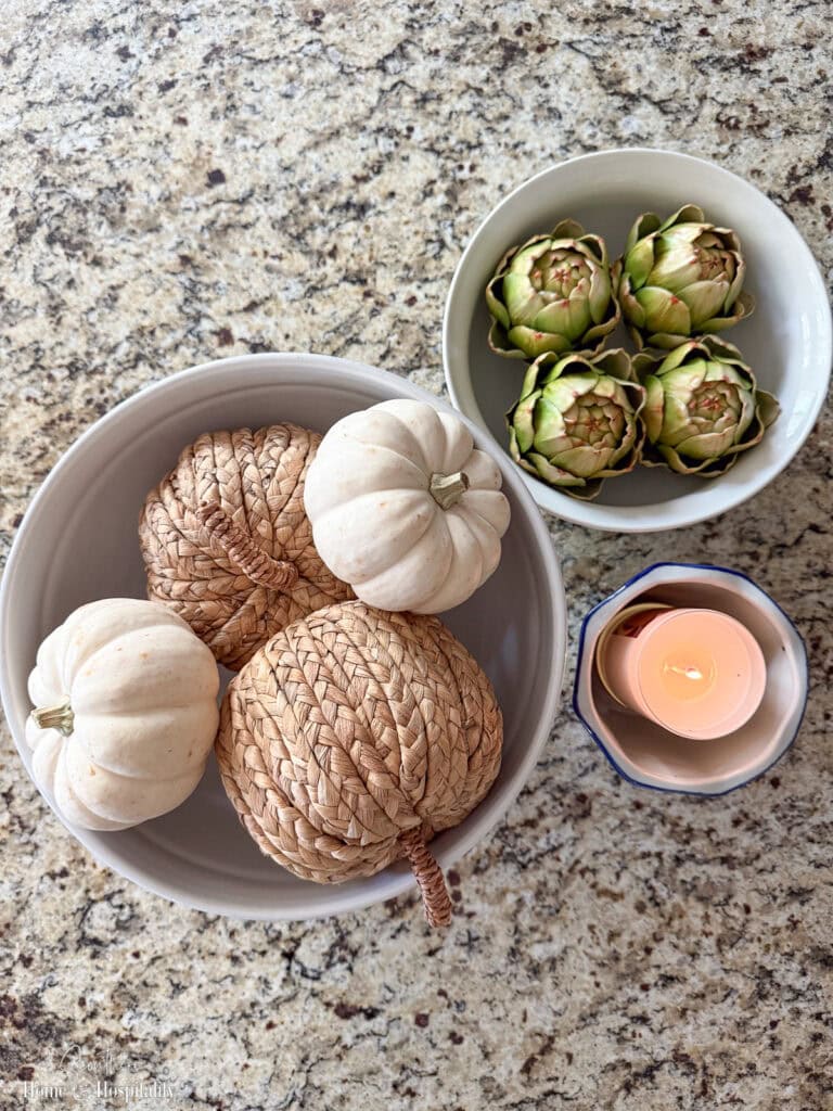 Overhead shot of fall kitchen island decor in neutral colors.
