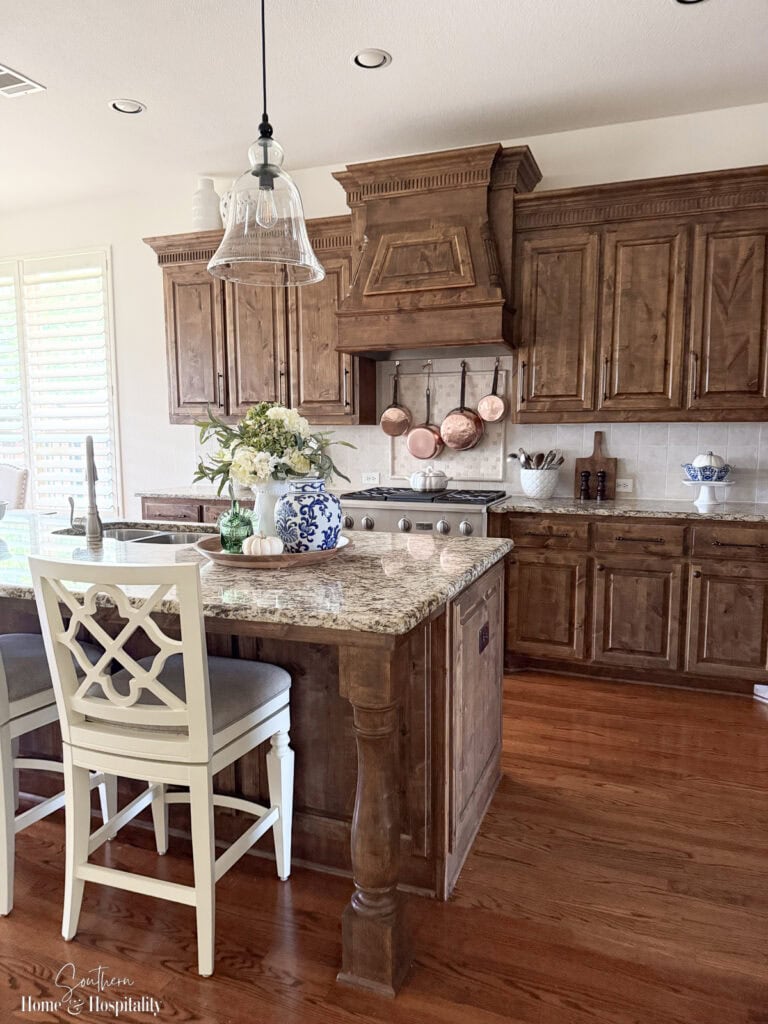 Blue and green fall kitchen decor with hydrangeas and natural textures.