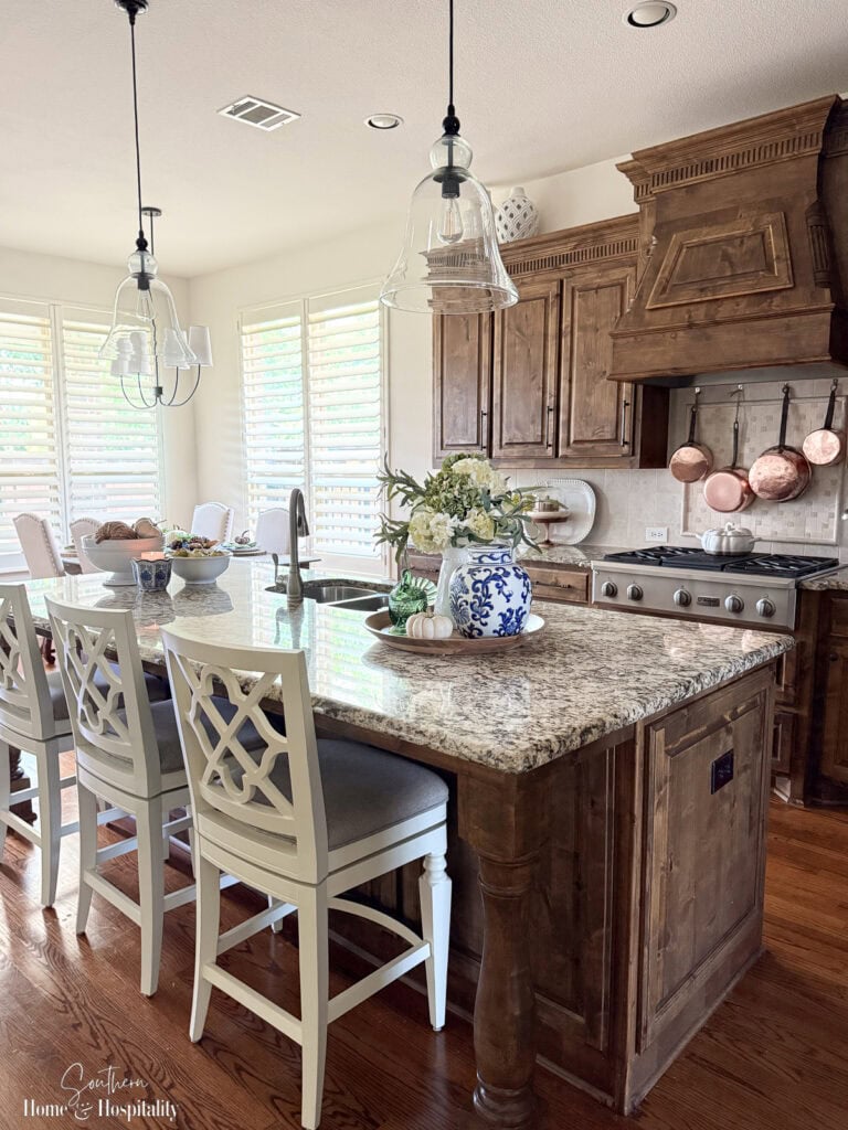 Subdued fall color palette softening brown granite countertops.