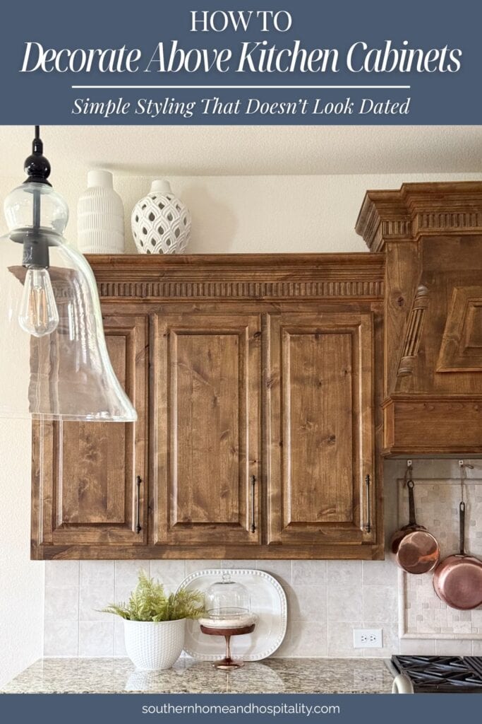 Minimal decor above kitchen cabinets with large white pottery, showing how to decorate above kitchen cabinets without clutter