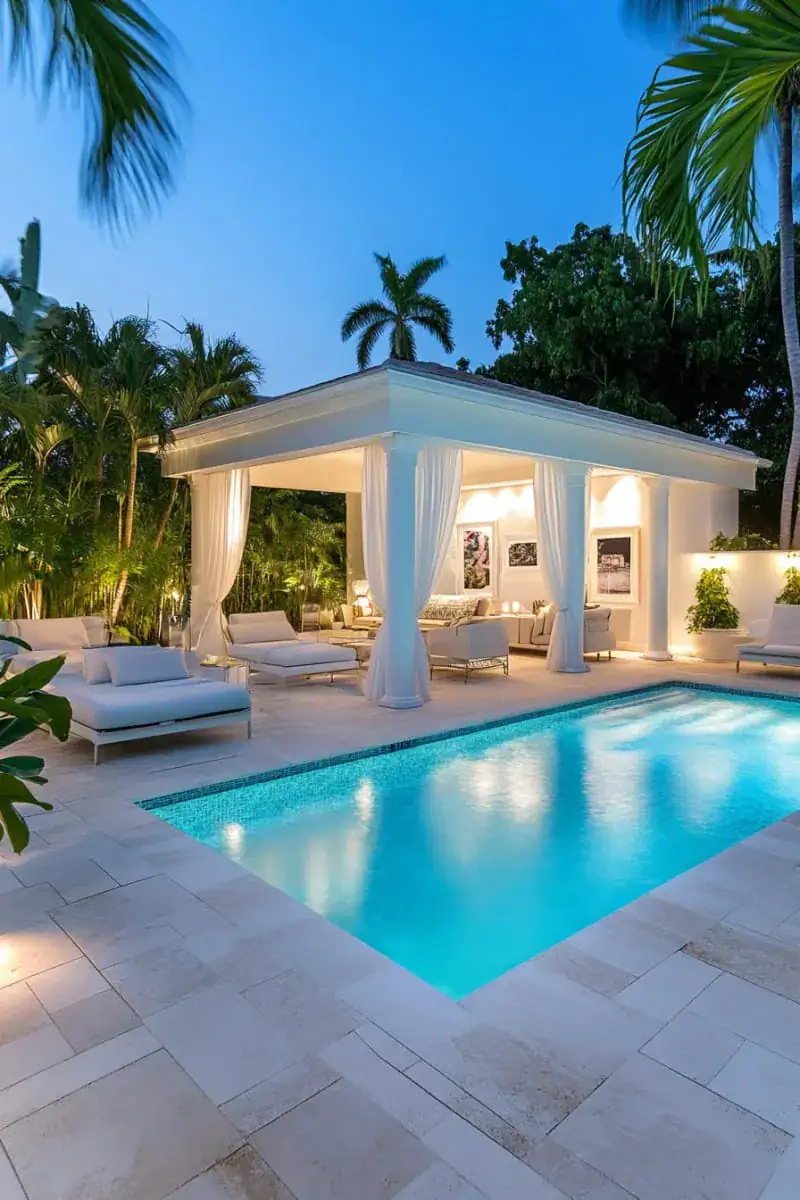 Pool cabana with curtains